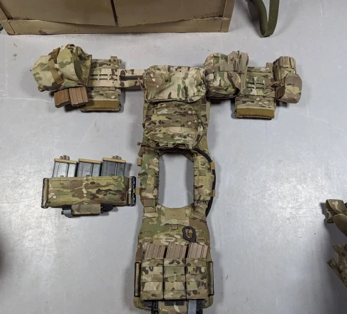 Posted a breakdown of the MSV some time ago and I believe it's near it's final stages of how I like it.MSV GEN 2

    AXL Equinox Cummerbund-Best cummerbund ever used hands down.

    VXV Skeletal Grid -Not as good of a solution as AXL's cummerbund retrofit kit but less of a hassle to adjust with side plates and clothing.

    SKD PIG MOLLE Side Plate carriers-Can be adjusted for height easily and can fit both 6x8 and 6x6 plates.

    Tac tailor fight light double-Can also fit Hk417 pattern mags when loosened enough. I forgot if it fits a 152.

    Coyote Tactical Shoulder pads-Not as good at load bearing as AXL's solution. Rubbed my neck raw the first couple of times wearing it but is now pretty great.

    Midwest armor GP double mag pouch-Apparently it can fit padded inserts for nods. Pretty slick little pouch.

    Dynamic Principle Placards-Took a minute to get them because I asked for a custom m110a1 insert for a wide placard. Worth the wait, customer service is awesome and quality rocks as well.